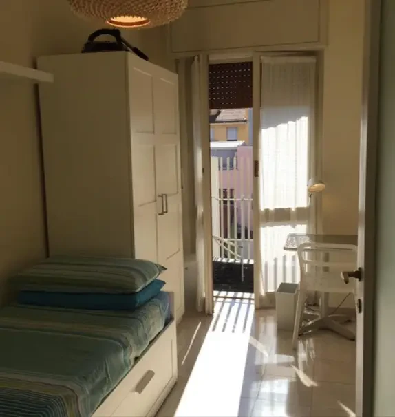 Bright private room with balcony in elegant Milan apartment