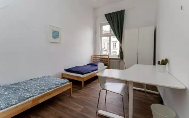 Bed in a homely twin bedroom, in Tiergarten 2