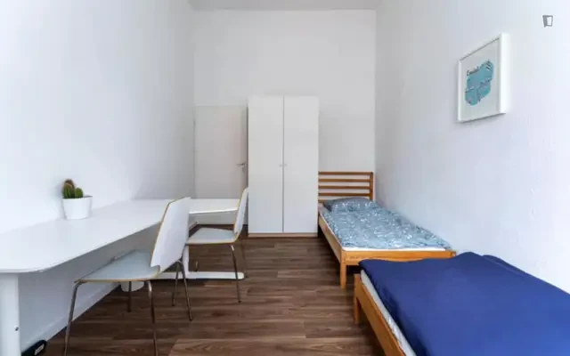Bed in a homely twin bedroom, in Tiergarten 0