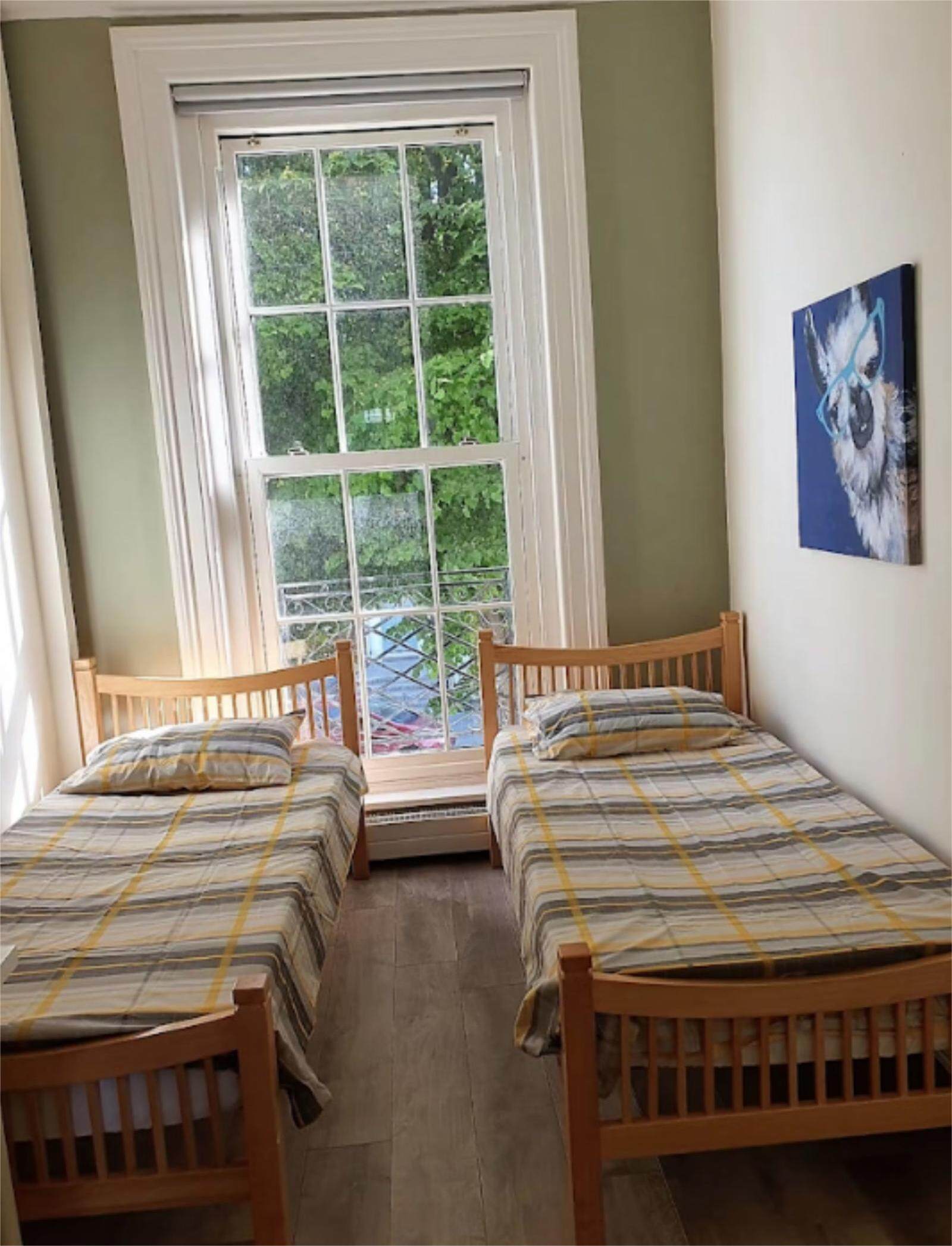 Bed in. a pleasant twin bedroom, in Broadstone
