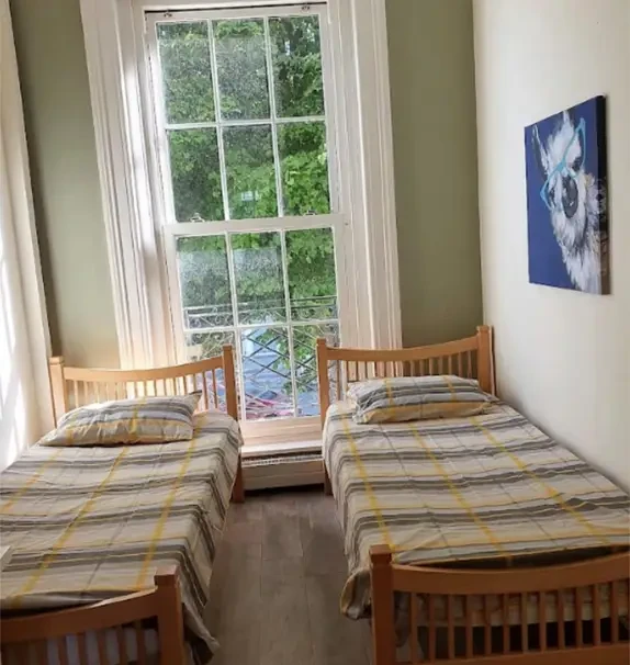 Bed in. a pleasant twin bedroom, in Broadstone