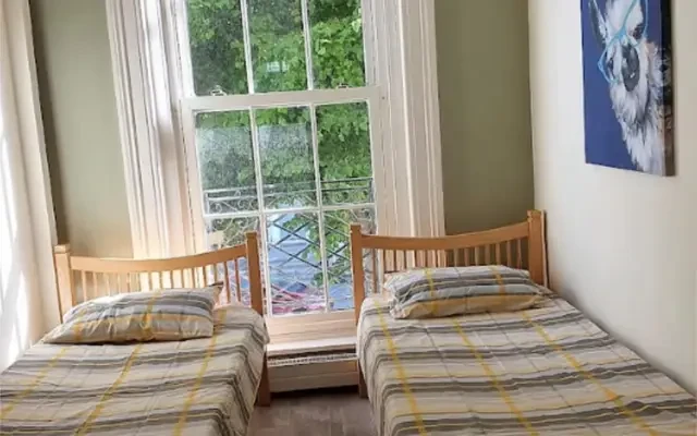 Bed in. a pleasant twin bedroom, in Broadstone 1